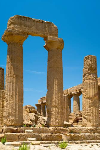 1140972197 SICILY, ITALY: Doric style stone columns of the Temple of Juno ( Hera ) in the Valley of the Temples, Agrigento, Sicily, Italy.. (Photo by Tim Graham/Getty Images)