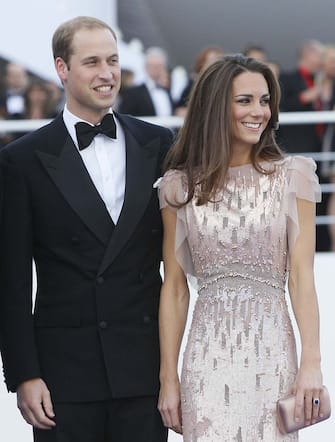 Fashion Best Dressed List FILE- Britain's Prince William, the Duke of Cambridge, and his wife Kate, Duchess of Cambridge arrive at a charity event for Absolute Return for Kids, ARK, in London, in this Thursday, June, 9, 2011 file photo. The Duchess of Cambridge is on the latest Vanity Fair International Best Dressed List. She had appeared once before, in 2008. (AP Photo/Alastair Grant, file)