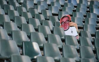 A cardboard cut-out with a portrait of a Borussia Moenchegladbach supporter is seen at the Borussia Park football stadium in Moenchengladbach, western Germany, on April 16, 2020, amid the novel coronavirus COVID-19 pandemic. - Large-scale public events such as football matches will remain banned in Germany until August 31 due to the coronavirus crisis, Berlin said on Wednesday, April 15, 2020, though it did not rule out allowing Bundesliga games to continue behind closed doors. (Photo by Ina FASSBENDER / AFP) (Photo by INA FASSBENDER/AFP via Getty Images)