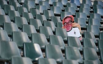 1210092783 A cardboard cut-out with a portrait of a Borussia Moenchegladbach supporter is seen at the Borussia Park football stadium in Moenchengladbach, western Germany, on April 16, 2020, amid the novel coronavirus COVID-19 pandemic. - Large-scale public events such as football matches will remain banned in Germany until August 31 due to the coronavirus crisis, Berlin said on Wednesday, April 15, 2020, though it did not rule out allowing Bundesliga games to continue behind closed doors. (Photo by Ina FASSBENDER / AFP) (Photo by INA FASSBENDER/AFP via Getty Images)
