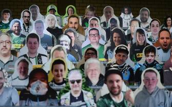 1210092753 Cardboard cut-outs with portraits of Borussia Moenchegladbach's supporters are seen at the Borussia Park football stadium in Moenchengladbach, western Germany, on April 16, 2020, amid the novel coronavirus COVID-19 pandemic. - Large-scale public events such as football matches will remain banned in Germany until August 31 due to the coronavirus crisis, Berlin said on Wednesday, April 15, 2020, though it did not rule out allowing Bundesliga games to continue behind closed doors. (Photo by Ina FASSBENDER / AFP) (Photo by INA FASSBENDER/AFP via Getty Images)