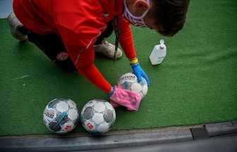 The footballs are disinfected during the German first division Bundesliga football match Fortuna Dusseldorf v SC Paderborn on May 16, 2020 in Duesseldorf, western Germany as the season resumed following a two-month absence due to the novel coronavirus COVID-19 pandemic. (Photo by SASCHA SCHUERMANN / various sources / AFP) / DFL REGULATIONS PROHIBIT ANY USE OF PHOTOGRAPHS AS IMAGE SEQUENCES AND/OR QUASI-VIDEO (Photo by SASCHA SCHUERMANN/AFP via Getty Images)
