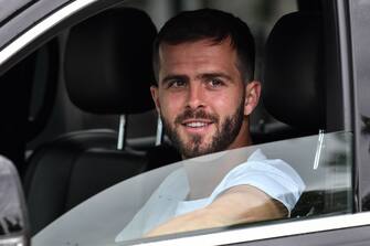 Juventus' Bosnian midfielder Miralem Pjanic arrives in his car to attend training on May 19, 2020 at the club's Continassa training ground in Turin, as the country's lockdown is easing after over two months, aimed at curbing the spread of the COVID-19 infection, caused by the novel coronavirus. (Photo by Marco Bertorello / AFP) (Photo by MARCO BERTORELLO/AFP via Getty Images)