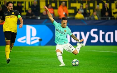 Inter Milan's Argentinian forward Lautaro Martinez scores the opening goal during the UEFA Champions League Group F football match BVB Borussia Dortmund v Inter Milan in Dortmund, western Germany, on November 5, 2019. (Photo by INA FASSBENDER / AFP) (Photo by INA FASSBENDER/AFP via Getty Images)