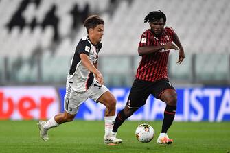 1219613318 TURIN, ITALY - JUNE 12: Paulo Dybala (L) of Juventus in action against Franck Kessie of AC Milan during the Coppa Italia Semi-Final Second Leg match between Juventus and AC Milan at Allianz Stadium on June 12, 2020 in Turin, Italy. (Photo by Valerio Pennicino/Getty Images)