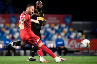 Napoli's Colombian goalkeeper David Ospina (L) clears a ball under pressure from Inter Milan's Belgian forward Romelu Lukaku during the Italian Cup (Coppa Italia) semi-final second leg football match Napoli vs Inter Milan on June 13, 2020 at the San Paolo stadium in Naples, played behind closed doors as the country gradually eases its lockdown aimed at curbing the spread of the COVID-19 infection, caused by the novel coronavirus. (Photo by Filippo MONTEFORTE / AFP) (Photo by FILIPPO MONTEFORTE/AFP via Getty Images)