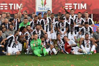 Juventus' players celebrate with the trophy after winning the Italian Tim Cup final on May 17, 2017 at the Olympic stadium in Rome. Dani Alves and Leonardo Bonucci struck one apiece as treble-chasing Juventus secured a third successive Italian Cup with a 2-0 victory over Lazio at the Stadio Olimpico today.


Juventus, who won a league and Cup double the past two seasons, can clinch a record sixth consecutive Serie A title -- and a record third successive double -- with victory at home to Crotone in their penultimate Serie A game of the season on Sunday.
 / AFP PHOTO / Andreas SOLARO        (Photo credit should read ANDREAS SOLARO/AFP via Getty Images)