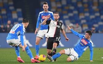NAPLES, ITALY - JANUARY 26: Miralem Pjanic of Juventus vies with Diego Demme of SSC Napoli during the Serie A match between SSC Napoli and  Juventus at Stadio San Paolo on January 26, 2020 in Naples, Italy. (Photo by Francesco Pecoraro/Getty Images)