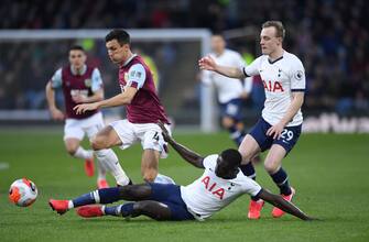 BURNLEY, ENGLAND - MARCH 07: Burnley player Jack Cork is challenged by Davinson Sanchez of Spurs during the Premier League match between Burnley FC and Tottenham Hotspur at Turf Moor on March 07, 2020 in Burnley, United Kingdom. (Photo by Stu Forster/Getty Images)