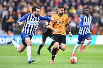 WOLVERHAMPTON, ENGLAND - MARCH 07: Ruben Neves of Wolverhampton Wanderers is challenged by Davy Propper of Brighton and Hove Albion during the Premier League match between Wolverhampton Wanderers and Brighton & Hove Albion at Molineux on March 07, 2020 in Wolverhampton, United Kingdom. (Photo by Nathan Stirk/Getty Images)