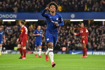 Chelsea's Brazilian midfielder Willian celebrates scoring the opening goalduring the English FA Cup fifth round football match between Chelsea and Liverpool at Stamford Bridge in London on March 3, 2020. (Photo by Glyn KIRK / AFP) / RESTRICTED TO EDITORIAL USE. No use with unauthorized audio, video, data, fixture lists, club/league logos or 'live' services. Online in-match use limited to 120 images. An additional 40 images may be used in extra time. No video emulation. Social media in-match use limited to 120 images. An additional 40 images may be used in extra time. No use in betting publications, games or single club/league/player publications. /  (Photo by GLYN KIRK/AFP via Getty Images)