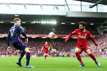 LIVERPOOL, ENGLAND - MARCH 07: Mohamed Salah of Liverpool and Jack Stacey of Bournemouth during the Premier League match between Liverpool FC and AFC Bournemouth  at Anfield on March 7, 2020 in Liverpool, United Kingdom. (Photo by Robbie Jay Barratt - AMA/Getty Images)