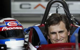 LAUSITZ, GERMANY - MAY 11: Ex Formula 1 and CART racing driver Alex Zanardi of Italy prepares to drive in his specially adapted Cart for his disability caused by a crash in Germany in 2001 at the Euro Speedway in Lausitz May 11, 2003 in Germany. (Photo by Mark Thompson/Getty Images).