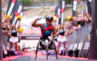 BARCELONA, SPAIN - SEPTEMBER 30:  Former Formula One driver and paracyclist Alex Zanardi celebrates as he crosses the finish line of the IRONMAN Barcelona on September 30, 2017 in Calella, Barcelona province, Spain.  (Photo by Alex Caparros/Getty Images for IRONMAN)