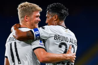 GENOA, ITALY - JUNE 23: Andreas Cornelius of Parma (left) celebrates with Bruno Alves after scoring his second goal during the Serie A match between Genoa CFC and Parma Calcio at Stadio Luigi Ferraris on June 23, 2020 in Genoa, Italy. (Photo by Paolo Rattini/Getty Images)