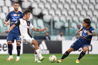 TURIN, ITALY - JUNE 26:  Paulo Dybala  (L) of Juventus is challenged by Jacopo Petriccione of US Lecce during the Serie A match between Juventus and  US Lecce at Allianz Stadium on June 26, 2020 in Turin, Italy.  (Photo by Valerio Pennicino/Getty Images)