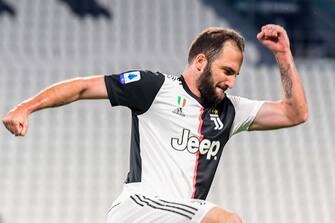 Juventus' Argentinian forward Gonzalo Higuain celebrates after scoring during the Italian Serie A football match Juventus vs Lecce played on June 26, 2020 behind closed doors at the Juventus stadium in Turin, as the country eases its lockdown aimed at curbing the spread of the COVID-19 infection, caused by the novel coronavirus. (Photo by Miguel MEDINA / AFP) (Photo by MIGUEL MEDINA/AFP via Getty Images)