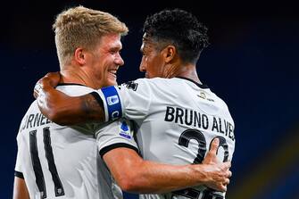 GENOA, ITALY - JUNE 23: Andreas Cornelius of Parma (left) celebrates with Bruno Alves after scoring his second goal during the Serie A match between Genoa CFC and Parma Calcio at Stadio Luigi Ferraris on June 23, 2020 in Genoa, Italy. (Photo by Paolo Rattini/Getty Images)