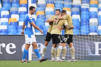 NAPLES, ITALY - JUNE 28: SPAL players celebrate the 1-1 goal scored by Andrea Petagna, beside the disappointment of Fabian Ruiz of SSC Napoli during the Serie A match between SSC Napoli and  SPAL at Stadio San Paolo on June 28, 2020 in Naples, Italy. (Photo by Francesco Pecoraro/Getty Images)