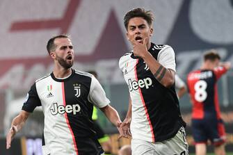 Juventus' Argentine forward Paulo Dybala celebrates after opening the scoring during the Italian Serie A football match Genoa vs Juventus played on June 30, 2020 behind closed doors at the Luigi-Ferraris stadium in Genoa, as the country eases its lockdown aimed at curbing the spread of the COVID-19 infection, caused by the novel coronavirus. (Photo by Miguel MEDINA / AFP) (Photo by MIGUEL MEDINA/AFP via Getty Images)