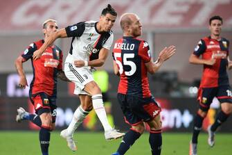 Juventus' Portuguese forward Cristiano Ronaldo shoots to score during the Italian Serie A football match Genoa vs Juventus played on June 30, 2020 behind closed doors at the Luigi-Ferraris stadium in Genoa, as the country eases its lockdown aimed at curbing the spread of the COVID-19 infection, caused by the novel coronavirus. (Photo by Miguel MEDINA / AFP) (Photo by MIGUEL MEDINA/AFP via Getty Images)