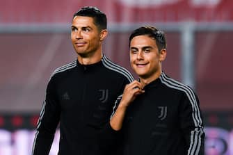 GENOA, ITALY - JUNE 30: Cristiano Ronaldo of Juventus (left) and Paulo Dybala of Juventus line-up before the Serie A match between Genoa CFC and Juventus FC at Stadio Luigi Ferraris on June 30, 2020 in Genoa, Italy. (Photo by Paolo Rattini/Getty Images)