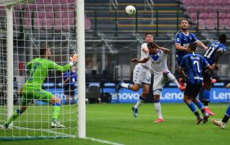 Inter Milan's Italian defender Danilo D'Ambrosio (Top R) scores a header during the Italian Serie A football match Inter vs Brescia played behind closed doors on July 1, 2020 at the Giuseppe-Meazza San Siro stadium in Milan, as the country eases its lockdown aimed at curbing the spread of the COVID-19 infection, caused by the novel coronavirus. (Photo by Miguel MEDINA / AFP) (Photo by MIGUEL MEDINA/AFP via Getty Images)