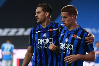 Atalanta's Croatian midfielder Mario Pasalic (R) celebrates with Atalanta's Brazilian defender Rafael Toloi after opening the scoring during the Italian Serie A football match Atalanta vs Napoli played on July 2, 2020 behind closed doors at the Atleti Azzurri d'Italia stadium in Bergamo, as the country eases its lockdown aimed at curbing the spread of the COVID-19 infection, caused by the novel coronavirus. (Photo by Miguel MEDINA / AFP) (Photo by MIGUEL MEDINA/AFP via Getty Images)