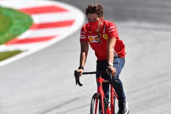TOPSHOT - Ferrari's Monegasque driver Charles Leclerc inspects the track on his bicycle on July 2, 2020, on the eve of the first practice session at the Austrian Formula One Grand Prix in Spielberg, Austria. - Seven months after they last competed in earnest, the Formula One circus will push a post-lockdown re-set button to open the 2020 season in Austria on July 5. (Photo by JOE KLAMAR / AFP) (Photo by JOE KLAMAR/AFP via Getty Images)