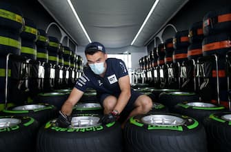 SPIELBERG, AUSTRIA - JULY 02:  Scuderia AlphaTauri team member works on tyres in the garage during previews for the F1 Grand Prix of Austria at Red Bull Ring on July 02, 2020 in Spielberg, Austria. (Photo by Peter Fox/Getty Images)