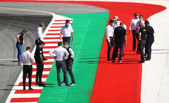SPIELBERG, AUSTRIA - JULY 02: Members of the FIA inspect the track during previews for the F1 Grand Prix of Austria at Red Bull Ring on July 02, 2020 in Spielberg, Austria. (Photo by Bryn Lennon/Getty Images)