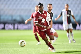 TURIN, ITALY - JULY 04:  Soualiho Meite of Torino FC in action against Miralem Pjanic of Juventus during the Serie A match between Juventus and Torino FC at Allianz Stadium on July 4, 2020 in Turin, Italy.  (Photo by Valerio Pennicino/Getty Images)
