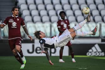 Juventus' Italian forward Federico Bernardeschi shoots a overhead kick during the Italian Serie A football match Juventus vs Torino played behind closed doors on July 4, 2020 at the Juventus stadium in Turin, as the country eases its lockdown aimed at curbing the spread of the COVID-19 infection, caused by the novel coronavirus. (Photo by Marco BERTORELLO / AFP) (Photo by MARCO BERTORELLO/AFP via Getty Images)