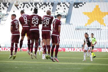 TURIN, ITALY - JULY 04: Juventus's Portuguese striker Cristiano Ronaldo scores from a second half free kick to give the side a 3-1 lead during the Serie A match between Juventus and Torino FC at Allianz Stadium on July 04, 2020 in Turin, Italy. (Photo by Jonathan Moscrop/Getty Images)
