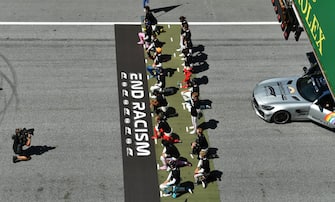 SPIELBERG, AUSTRIA - JULY 05: Some of the F1 drivers take a knee on the grid in support of the Black Lives Matter movement ahead of the Formula One Grand Prix of Austria at Red Bull Ring on July 05, 2020 in Spielberg, Austria. (Photo by Joe Klamar/Pool via Getty Images)
