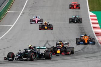 Mercedes' Finnish driver Valtteri Bottas (L) steers his car during the formation lap prior to the Austrian Formula One Grand Prix race on July 5, 2020 in Spielberg, Austria. (Photo by Darko Bandic / various sources / AFP) (Photo by DARKO BANDIC/POOL/AFP via Getty Images)