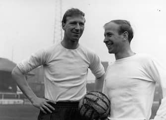 8th April 1965:  British footballers Jack Charlton (left) and his brother Bobby Charlton. They are both members of the England team. Bobby plays for Manchester United, Jack for Leeds United.  (Photo by Central Press/Getty Images)