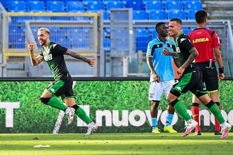 Sassuolo's Italian forward Francesco Caputo (L) celebrates after scoring  during the Italian Serie A football match Lazio Rome vs Sassuolo played behind closed doors on July 11, 2020 at the Olympic stadium in Rome, as the country eases its lockdown aimed at curbing the spread of the COVID-19 infection, caused by the novel coronavirus. (Photo by Vincenzo PINTO / AFP) (Photo by VINCENZO PINTO/AFP via Getty Images)