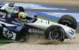 NURBURG, GERMANY - MAY 30: Ralf Schumacher of Germany and BMW Williams hits the gravel after being hit by Juan Pablo Montoya of Columbia and BMW Williams on the first corner during the European F1 Grand Prix on May 30, 2004, at the Nurburgring in Nurburg, Germany. (Photo by Paul Gilham/Getty Images)  *** Local Caption *** Ralf Schumacher