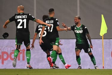 Sassuolo's midfielder Francesco Caputo from Italy (R) celebrates after scoring with his teammates during the Italian Serie A football match Sassuolo vs Juventus Turin played behind closed doors on July 15, 2020 at the Mapei stadium in Reggio Emilia, as the country eases its lockdown aimed at curbing the spread of the COVID-19 infection, caused by the novel coronavirus. (Photo by MARCO BERTORELLO / AFP) (Photo by MARCO BERTORELLO/AFP via Getty Images)