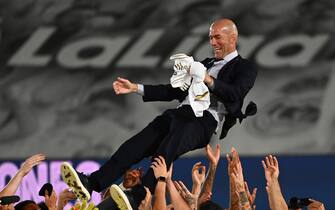 Real Madrid's players toos Real Madrid's French coach Zinedine Zidane after winning the Liga title  after the Spanish League football match between Real Madrid CF and Villarreal CF at the Alfredo di Stefano stadium in Valdebebas, on the outskirts of Madrid, on July 16, 2020. (Photo by GABRIEL BOUYS / AFP) (Photo by GABRIEL BOUYS/AFP via Getty Images)