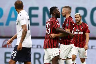 MILAN, ITALY - JULY 18:  Ante Rebic (R) of AC Milan celebrates his goal with his team-mate Franck Kessie (L) during the Serie A match between AC Milan and Bologna FC at Stadio Giuseppe Meazza on July 18, 2020 in Milan, Italy.  (Photo by Marco Luzzani/Getty Images)