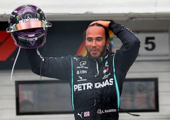 Mercedes' British driver Lewis Hamilton celebrates winning the Formula One Hungarian Grand Prix race at the Hungaroring circuit in Mogyorod near Budapest, Hungary, on July 19, 2020. (Photo by Leonhard Foeger / POOL / AFP) (Photo by LEONHARD FOEGER/POOL/AFP via Getty Images)