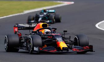 BUDAPEST, HUNGARY - JULY 19: Max Verstappen of the Netherlands driving the (33) Aston Martin Red Bull Racing RB16 leads Valtteri Bottas of Finland driving the (77) Mercedes AMG Petronas F1 Team Mercedes W11 during the Formula One Grand Prix of Hungary at Hungaroring on July 19, 2020 in Budapest, Hungary. (Photo by Darko Bandic/Pool via Getty Images)