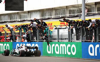 BUDAPEST, HUNGARY - JULY 19: Race winner Lewis Hamilton of Great Britain driving the (44) Mercedes AMG Petronas F1 Team Mercedes W11 passes his team celebrating on the pitwall during the Formula One Grand Prix of Hungary at Hungaroring on July 19, 2020 in Budapest, Hungary. (Photo by Bryn Lennon/Getty Images)