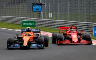 McLaren's British driver Lando Norris (L) and Ferrari's Monegasque driver Charles Leclerc steer their cars during the Formula One Hungarian Grand Prix race at the Hungaroring circuit in Mogyorod near Budapest, Hungary, on July 19, 2020. (Photo by Leonhard Foeger / POOL / AFP) (Photo by LEONHARD FOEGER/POOL/AFP via Getty Images)