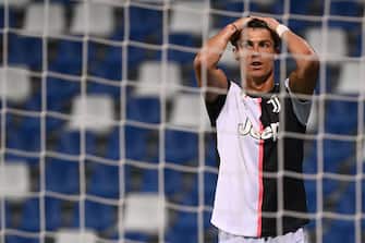 Juventus' Portuguese forward Cristiano Ronaldo reacts after missing a goal opportunity during the Italian Serie A football match between Sassuolo and Juventus Turin played behind closed doors on July 15, 2020 at the Mapei stadium in Reggio Emilia. (Photo by MARCO BERTORELLO / AFP) (Photo by MARCO BERTORELLO/AFP via Getty Images)
