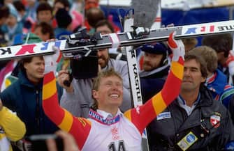 1636781 28 Feb 1988: Pirmin Zurbriggen of Switzerland raises his skies aloft after the Mens Downhill event at the 1988 Winter Olympic Games in Calgary, Canada. Zurbriggen won the gold medal with a time of 1:59.63 minutes. \ Mandatory Credit: Allsport UK /Allsport