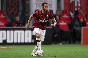 MILAN, ITALY - JULY 18: Turkish midfielder Hakan Calhanoglu of AC Milan during the Serie A match between AC Milan and  Bologna FC at Stadio Giuseppe Meazza on July 18, 2020 in Milan, Italy. (Photo by Jonathan Moscrop/Getty Images)