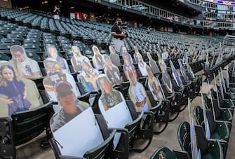 epa08565100 Cutouts of fans are placed in seats before the start of the MLB baseball game between the Minnesota Twins and the Chicago White Sox at Guaranteed Rate Field in Chicago, Illinois, USA, 24 July 2020. Major League Baseball has started an abbreviated 2020 season playing in ballparks without fans.  EPA/TANNEN MAURY